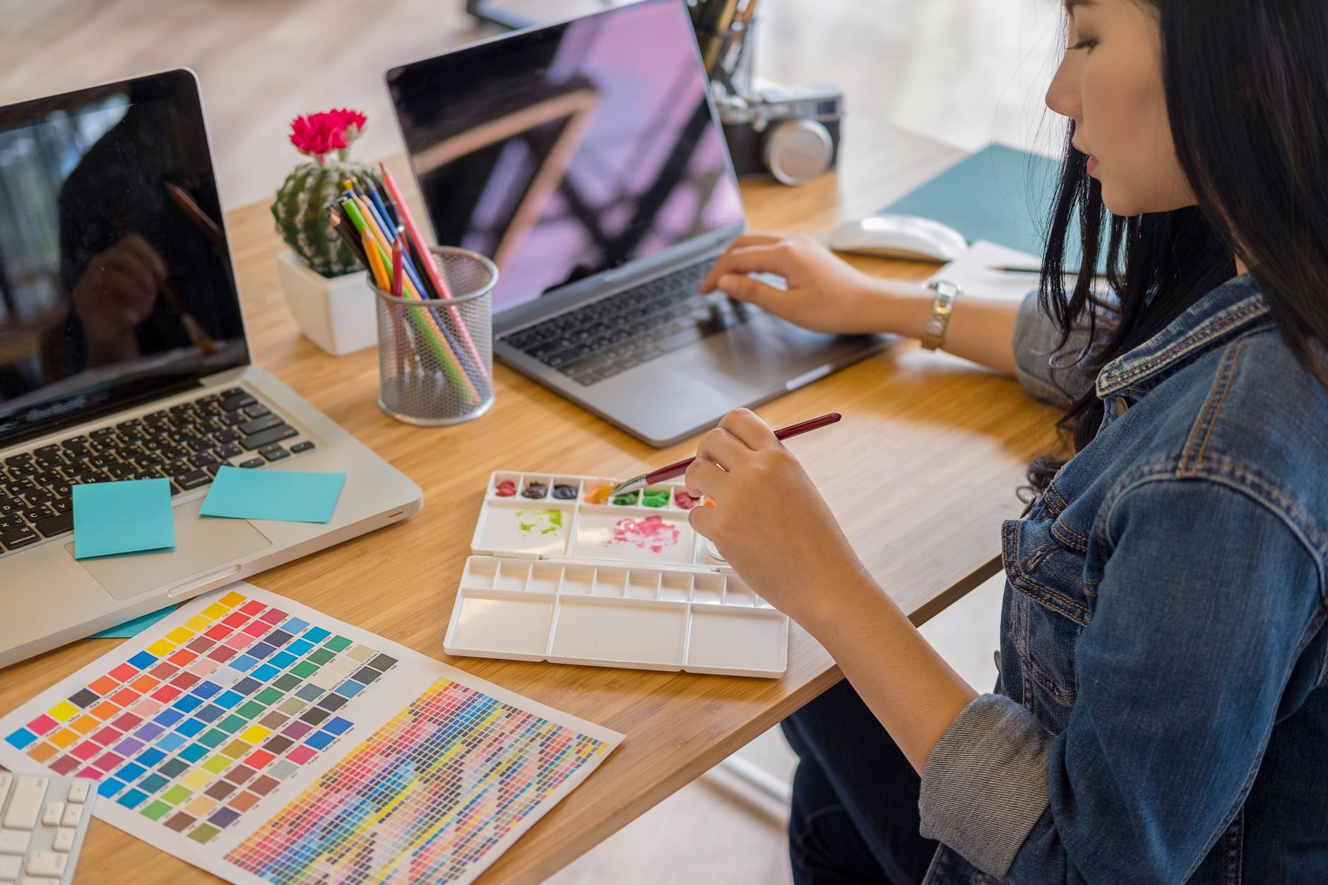 Woman at Desk Painting and Working