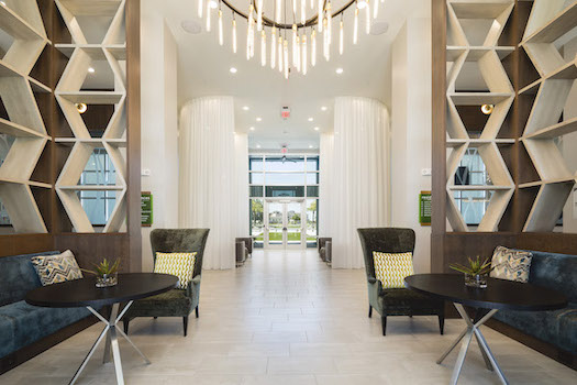 luxurious lobby at residences at the green with chandelier and seating