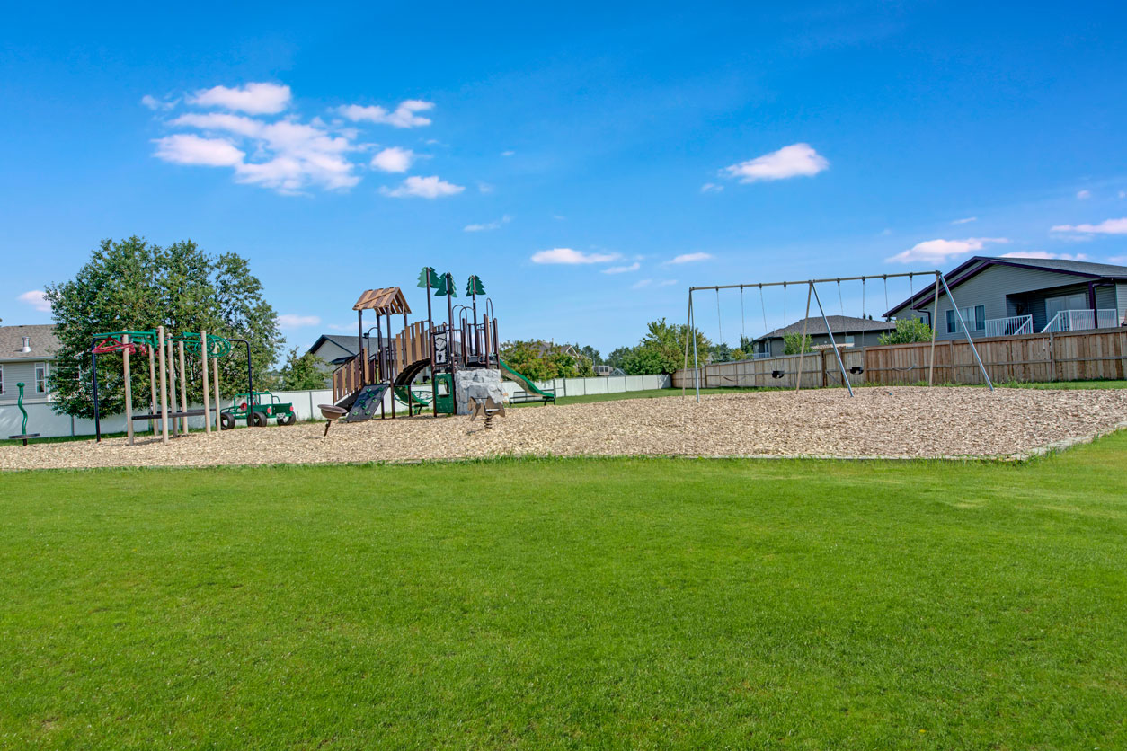 Outdoor playground at Sol Terrace Apartment Homes in Whitecourt, AB
