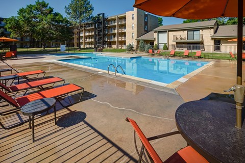 Pool Side Relaxing Area With Sundeck at Monaco Lakes, Denver, CO