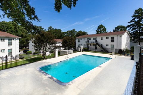 the swimming pool at 1861 muleshoe road with apartment buildings in the background