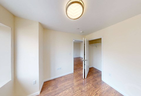 a renovated living room and hallway with a door to a closet