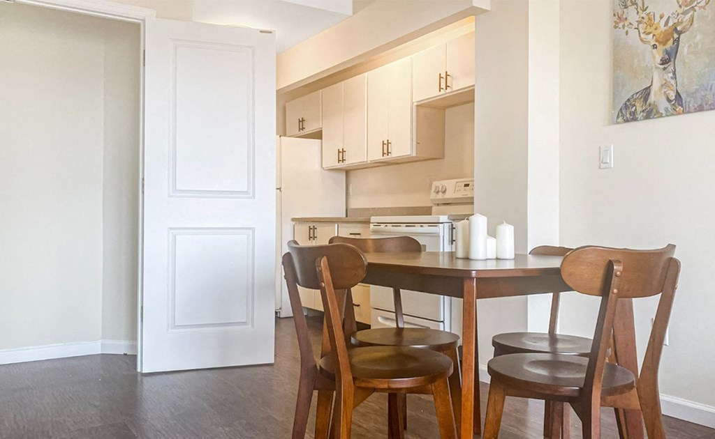 a kitchen with a table and chairs