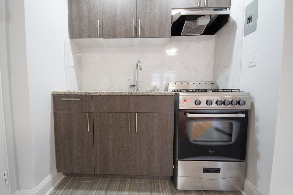 a small kitchen with a stove and a sink