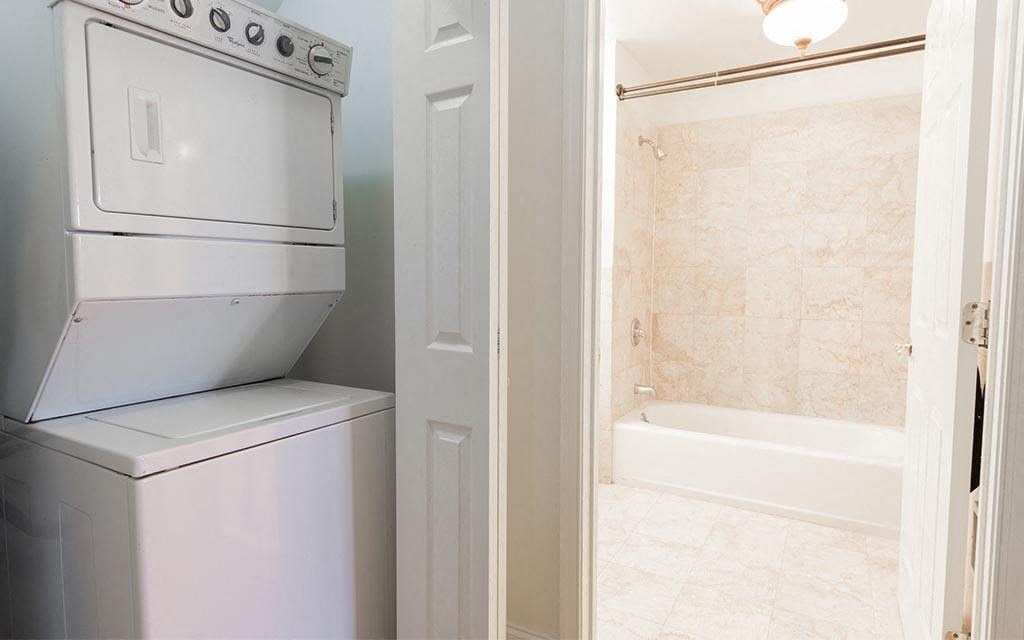 a white washer and dryer in a laundry room