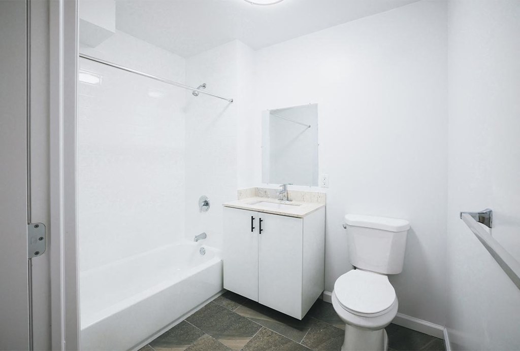 a bathroom with a sink toilet and a tub