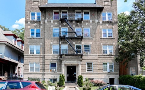 a brick apartment building with a fire escape