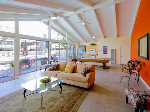 A living room with a sofa, chairs, and a coffee table.
