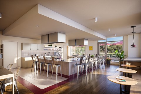 a view of a kitchen and dining room with tables and chairs