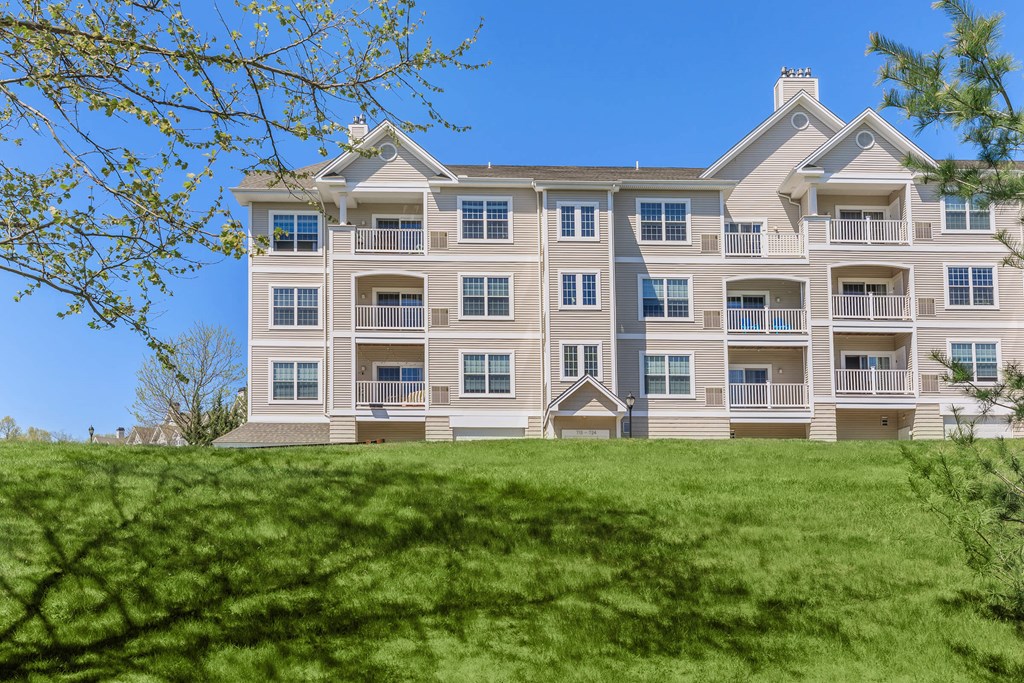 A large, multi-story building with a balcony on the second floor.