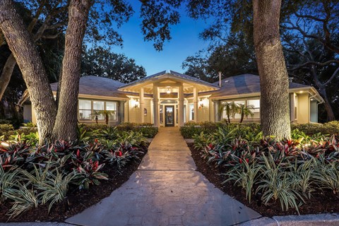 A house with a pathway leading to the front door.