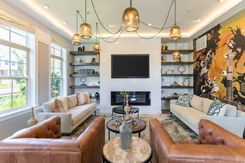 A living room with a fireplace and a television.