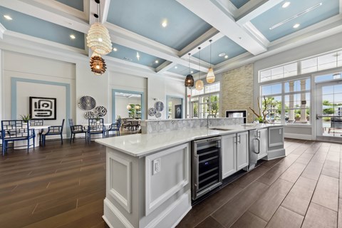 A kitchen with a large island and a dining area.