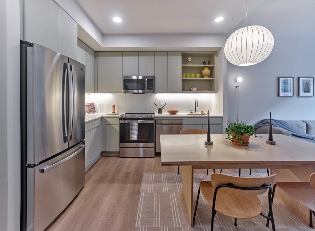 The cabinets in the kitchen at The Hazel are beautifully crafted, offering both functionality and aesthetic appeal