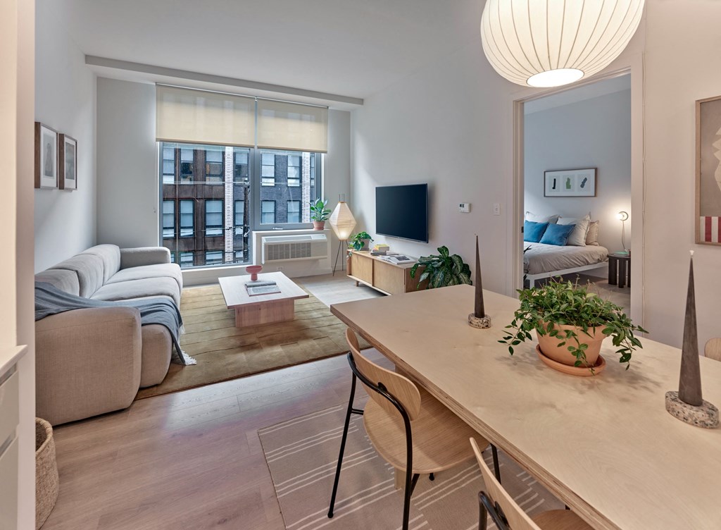 The living room at The Hazel is a stylish and inviting space, where comfort meets sophistication, providing residents with a versatile area to relax and entertain