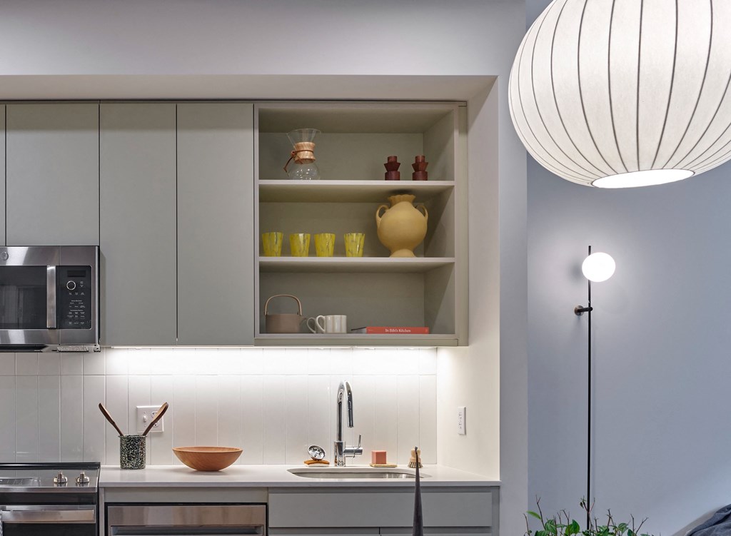 The cabinets in the kitchen at The Hazel are beautifully crafted, offering both functionality and aesthetic appeal