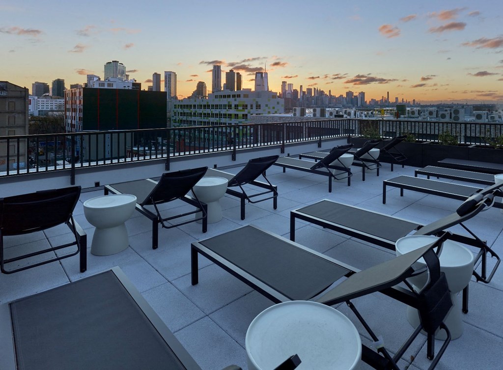 The sun deck at The Hazel is a sun-soaked oasis, featuring comfortable loungers, panoramic views