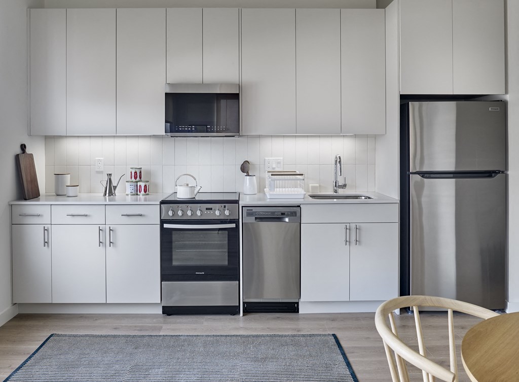 The kitchen boasts a sleek and modern design, complete with top-of-the-line electronic appliances, creating a culinary haven where you can effortlessly prepare meals with style and convenience.