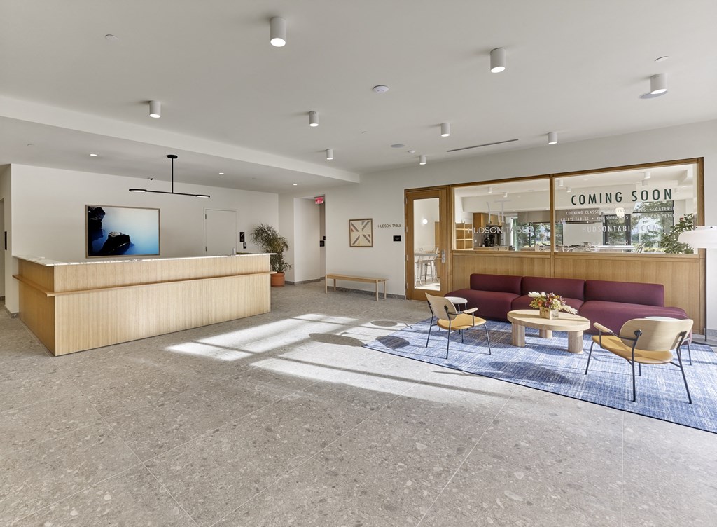 A stylish and welcoming lobby, adorned with modern decor and elegant furnishings, sets the tone for a sophisticated and inviting atmosphere.