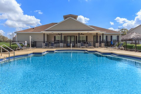 the pool at the whispering winds apartments in pearland, tx