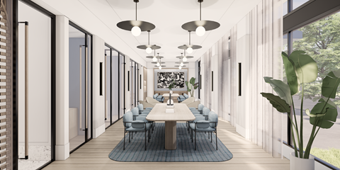 A modern dining room with a long table and chairs.