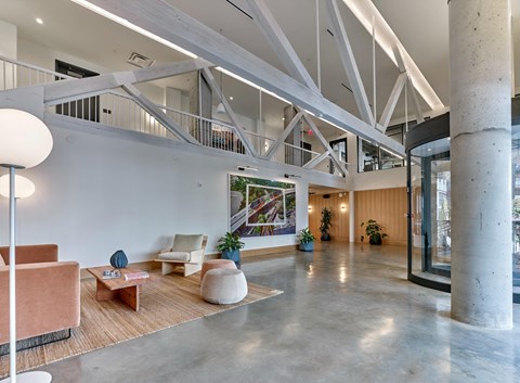 the lobby of a building with a lobby area and a staircase