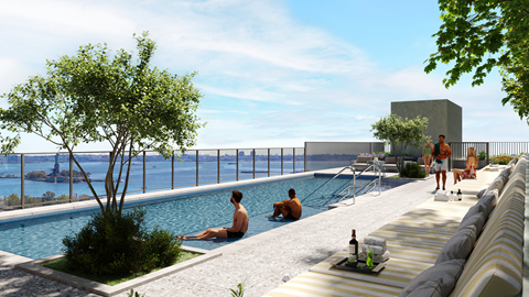 A pool area with people relaxing and a view of the water.