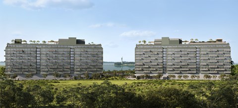 Two identical buildings are situated on a hill with trees in the foreground.