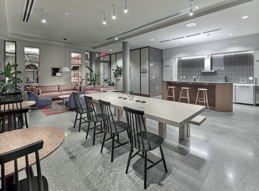 The community kitchen at The Hazel is a modern and well-equipped culinary hub, designed to foster community engagement and culinary creativity, providing residents with a communal space to cook, host gatherings, and share delightful meals