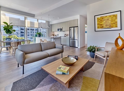 A modern living room with a large sofa and a coffee table.