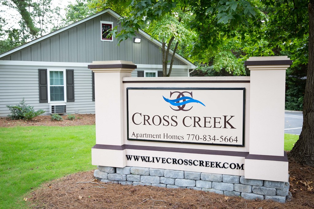 a sign in front of a house