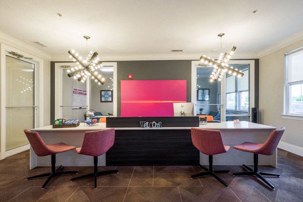 a kitchen and dining area with chairs and a counter at Linden on the GreeneWay, Florida, 32824