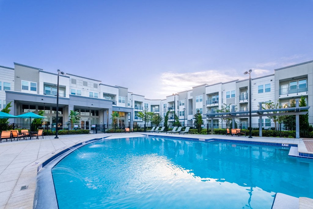 a large swimming pool in front of an apartment building at Linden on the GreeneWay, Florida