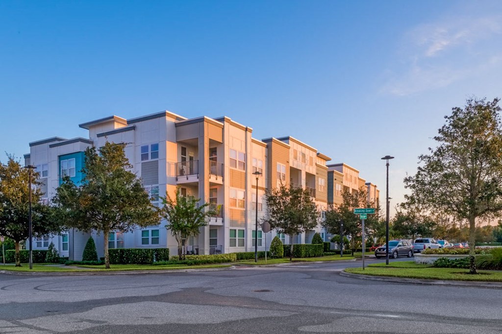 a street view of an apartment building with a parking lot at Linden on the GreeneWay, Florida, 32824