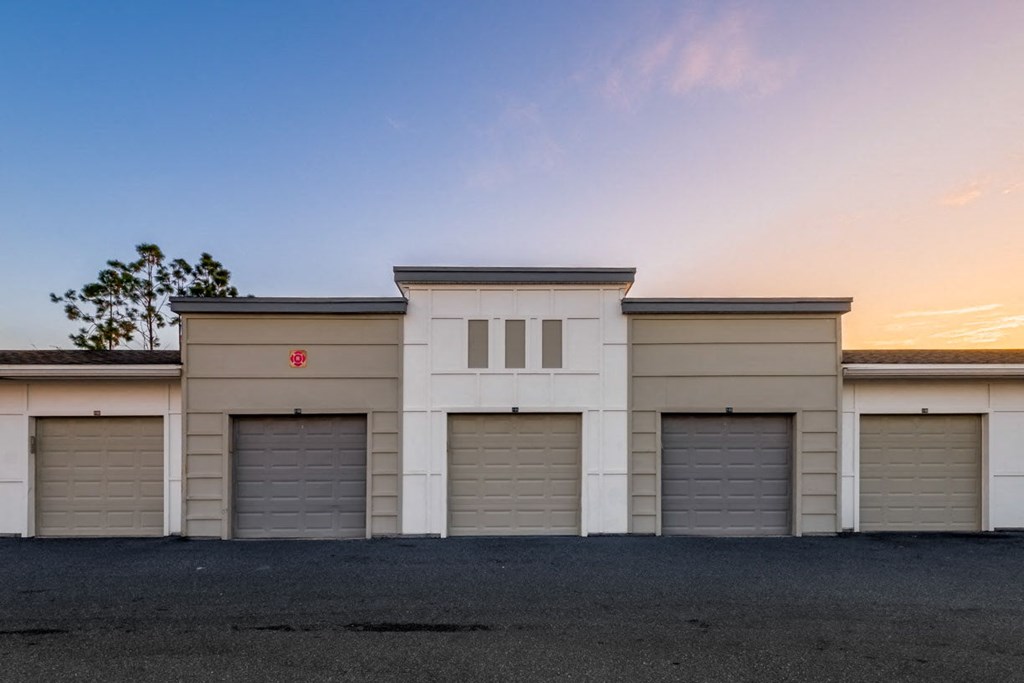 a row of garage doors on the side of a building at Linden on the GreeneWay, Orlando