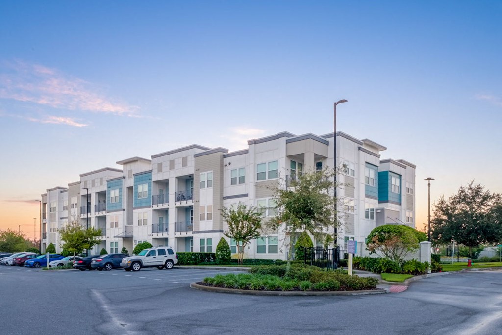 a building with cars parked in front of it at Linden on the GreeneWay, Orlando, 32824