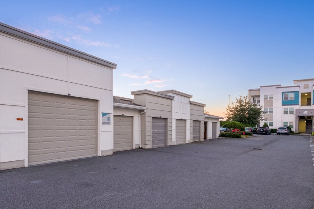 a row of garages on the side of a building at Linden on the GreeneWay, Florida, 32824