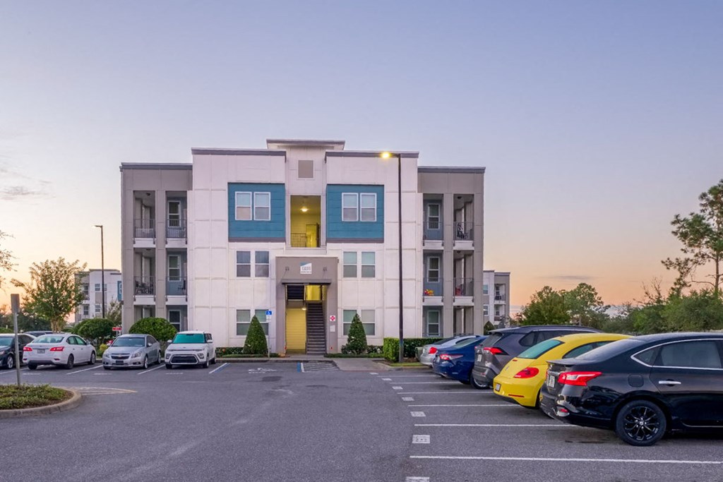 a building with cars parked in front of it at Linden on the GreeneWay, Florida