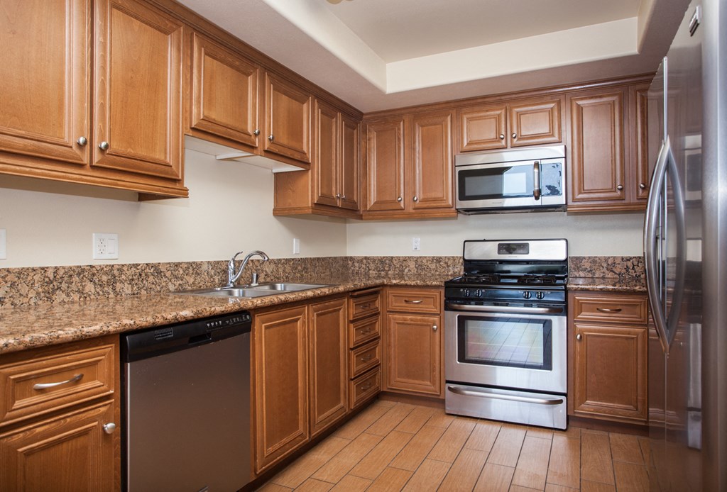 Fitted Kitchen With Island Dining at The Verandas, California