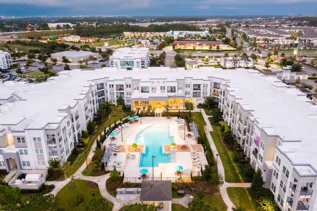 an aerial view of a building with a swimming pool  at Linden on the GreeneWay, Orlando, 32824