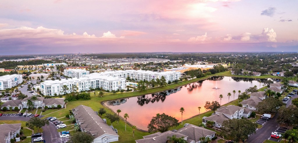 an aerial view of a body of water in a city with houses  at Linden on the GreeneWay, Florida, 32824