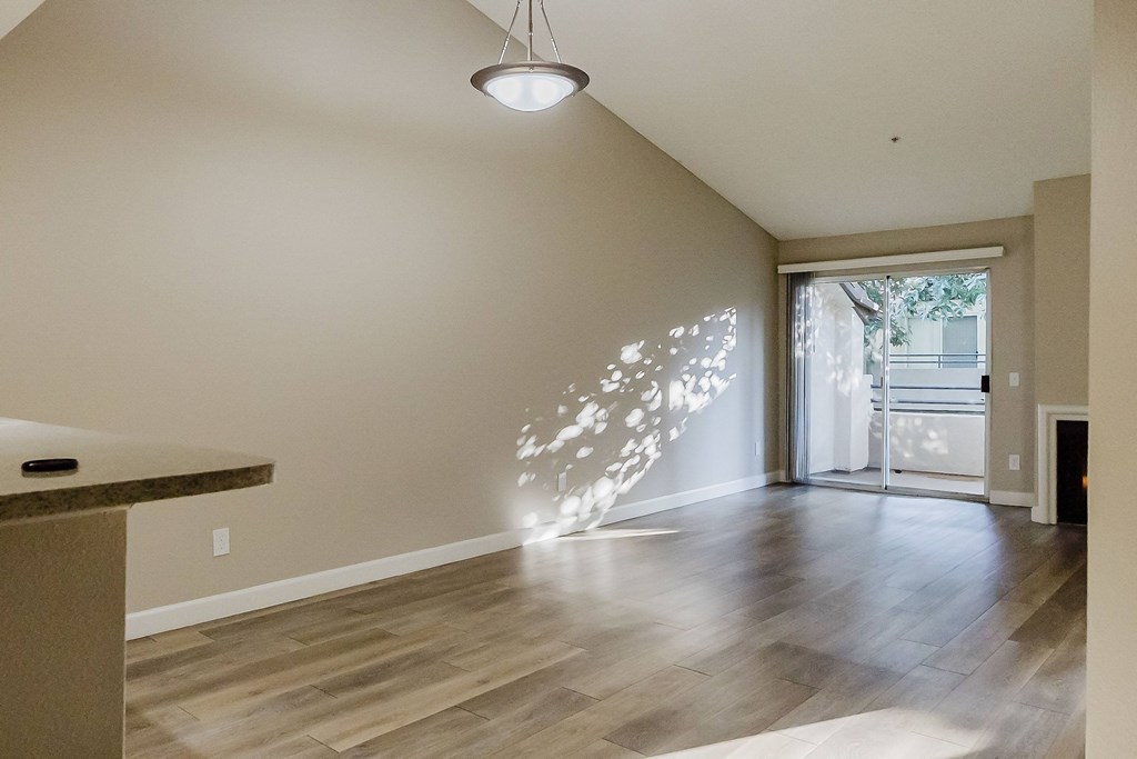 A room with a wooden floor and a ceiling light. at Legends at Rancho Belago, Moreno Valley, California