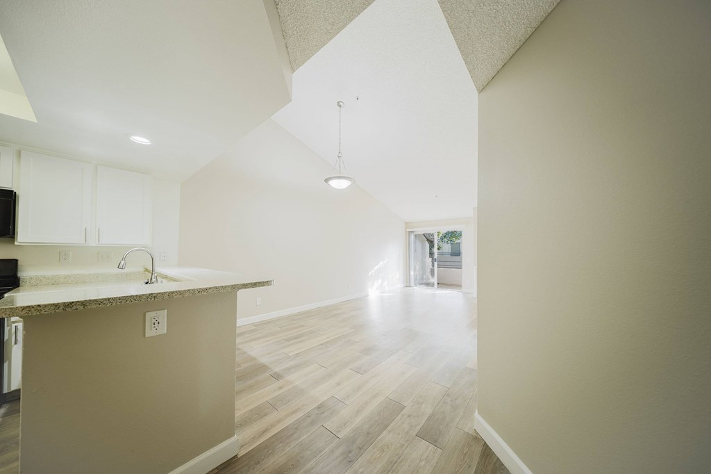 A kitchen with a counter and cabinets. at Legends at Rancho Belago, Moreno Valley