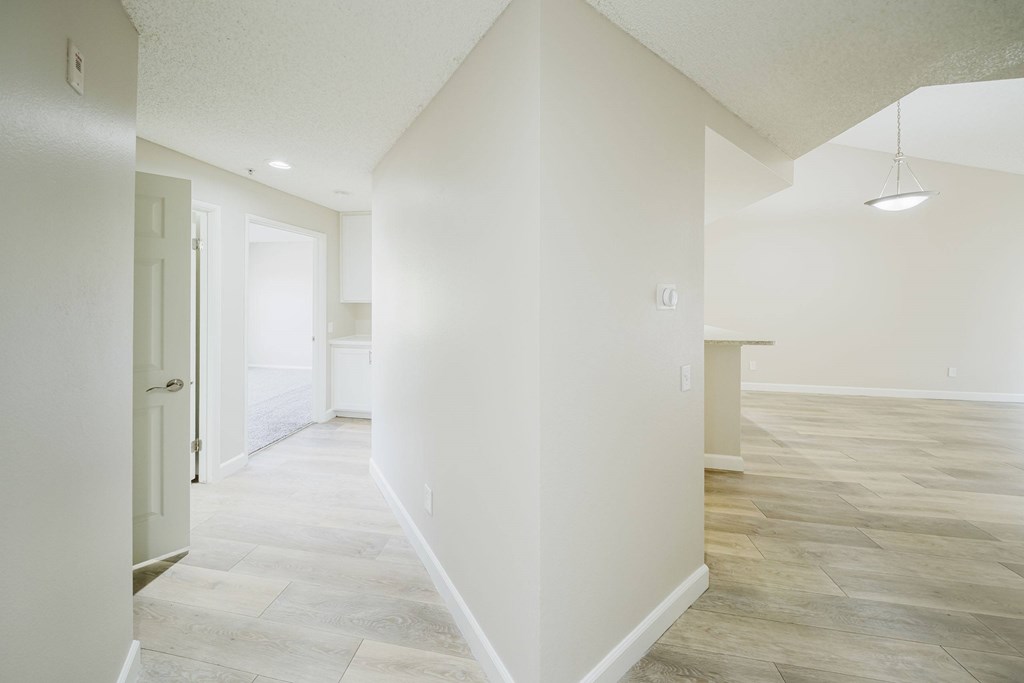 A spacious room with light-colored walls and a wooden floor. at Legends at Rancho Belago, California