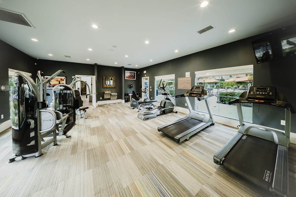 A gym with treadmilers, weights, and exercise equipment. at Legends at Rancho Belago, Moreno Valley, 92553
