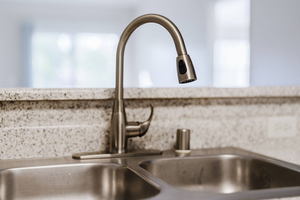 A kitchen sink with a chrome faucet. at Legends at Rancho Belago, Moreno Valley, California
