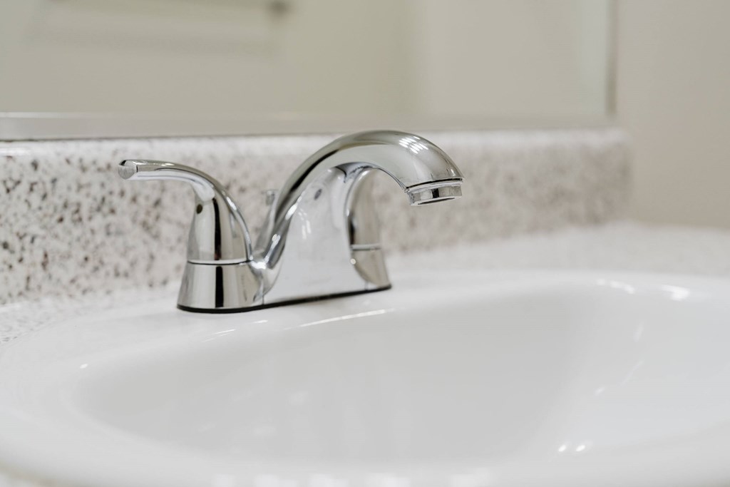 A white sink with a chrome faucet. at Legends at Rancho Belago, Moreno Valley, 92553