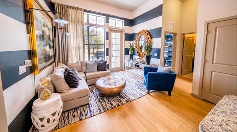 a living room with blue and white walls and a couch at Azul Baldwin Park, Orlando, 32814