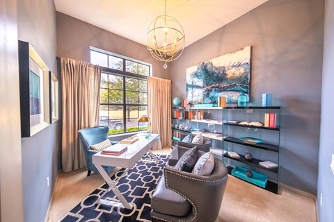 a home office with a desk and chair and a large window at Azul Baldwin Park, Orlando, Florida