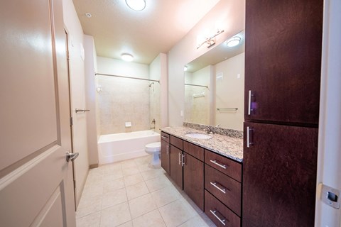 a bathroom with a sink and a shower and a toilet at Azul Baldwin Park, Florida